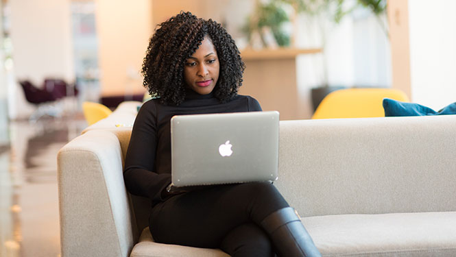 Woman working on a Macbook