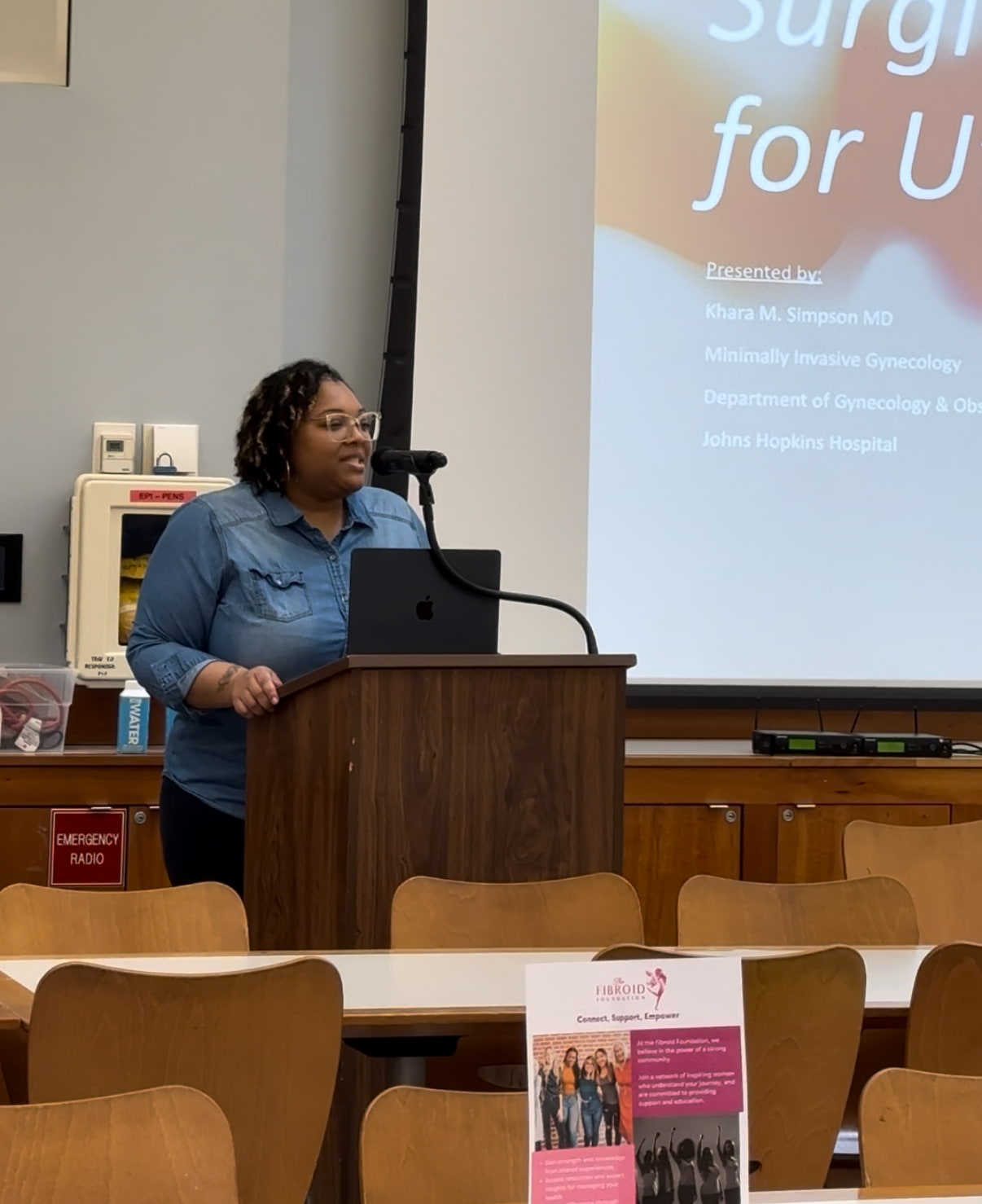 Woman speaking at a lectern